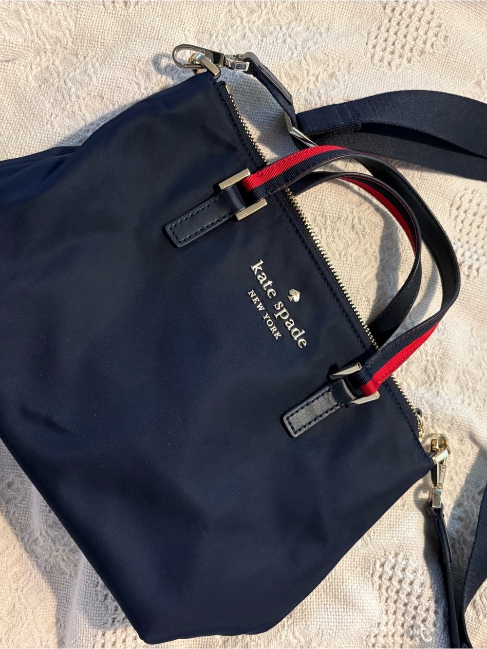 kate spade navy tote with red-accent handles